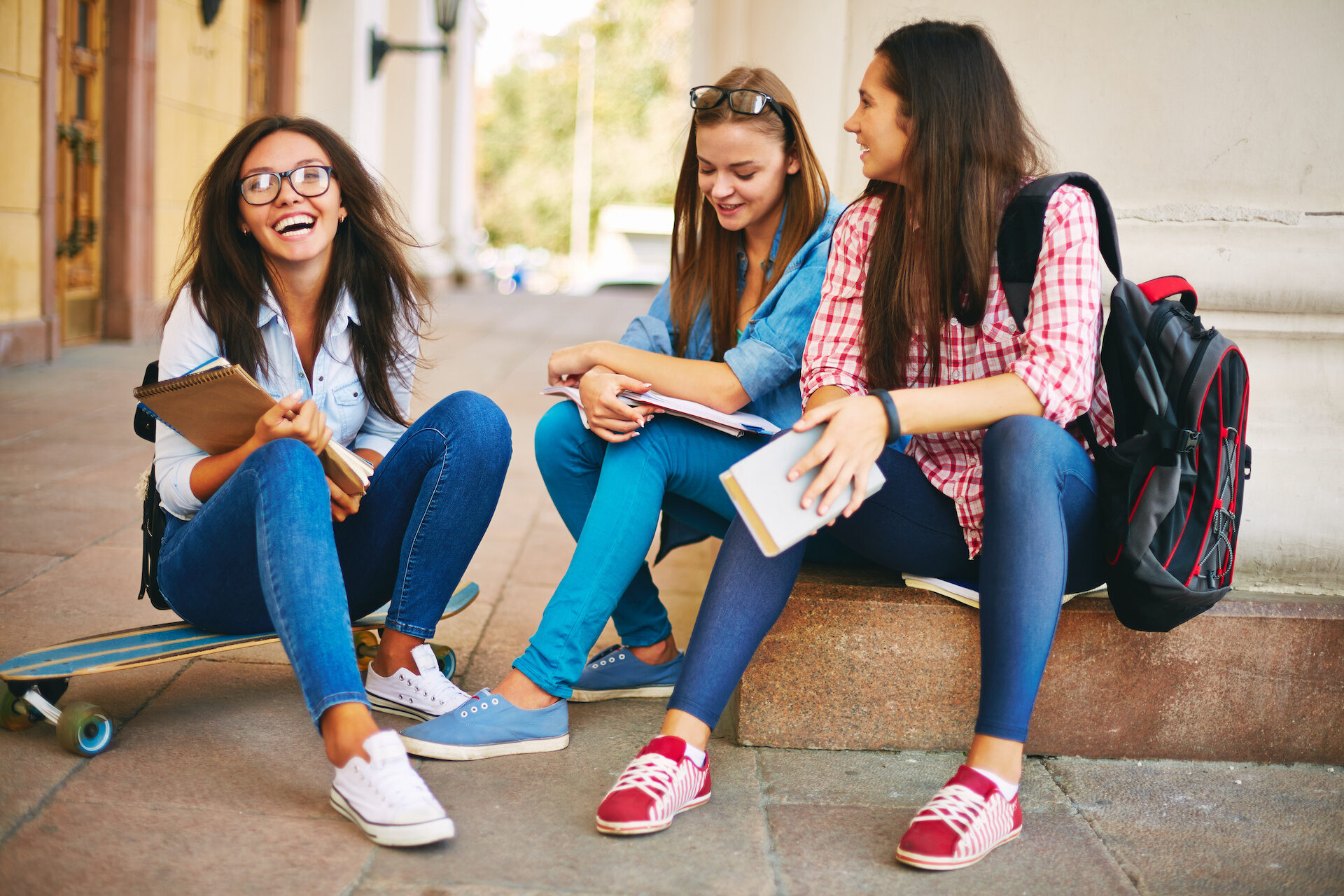 Teenage girls communicating on the street