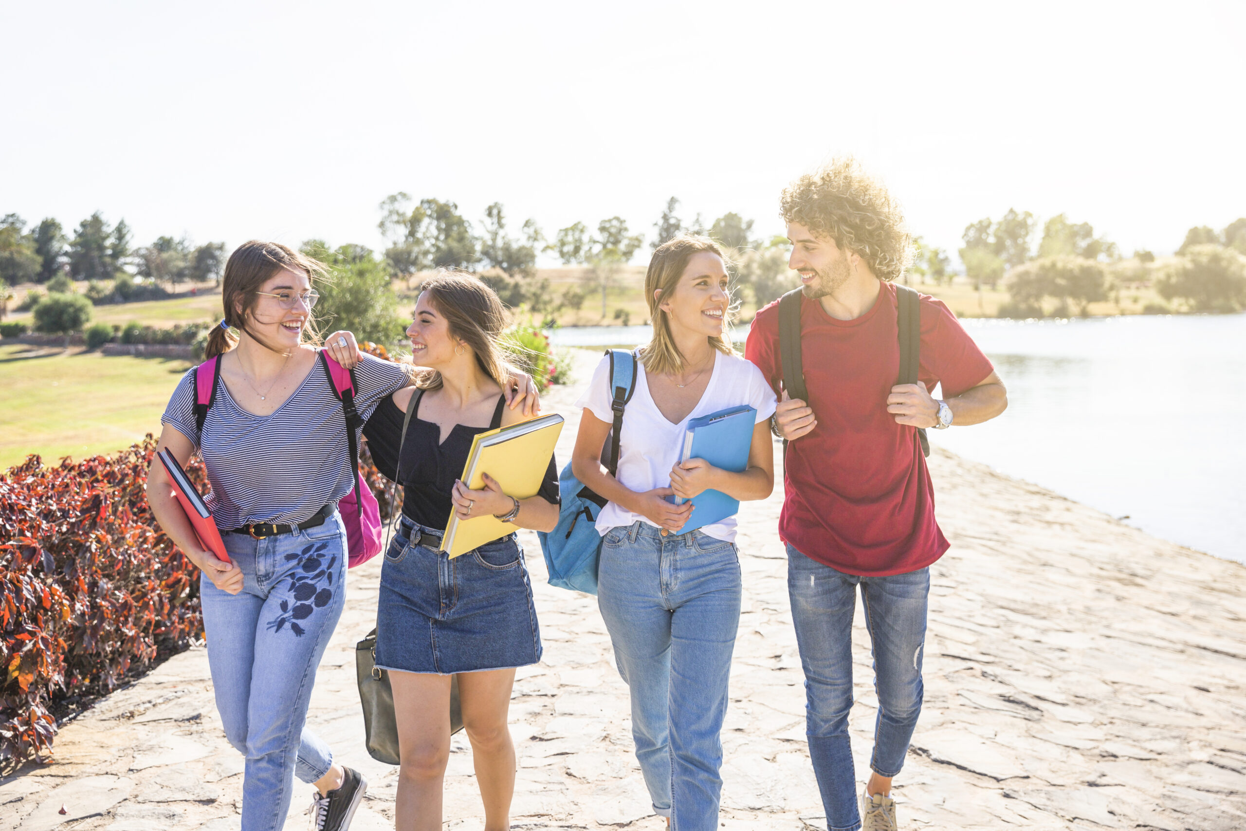 cheerful-friends-communicating-after-studies